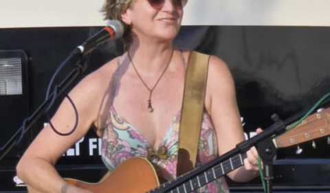 kim mayfield playing guitar 2023