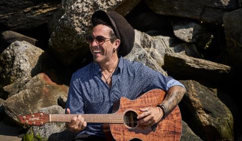 Image of Robinson with guitar